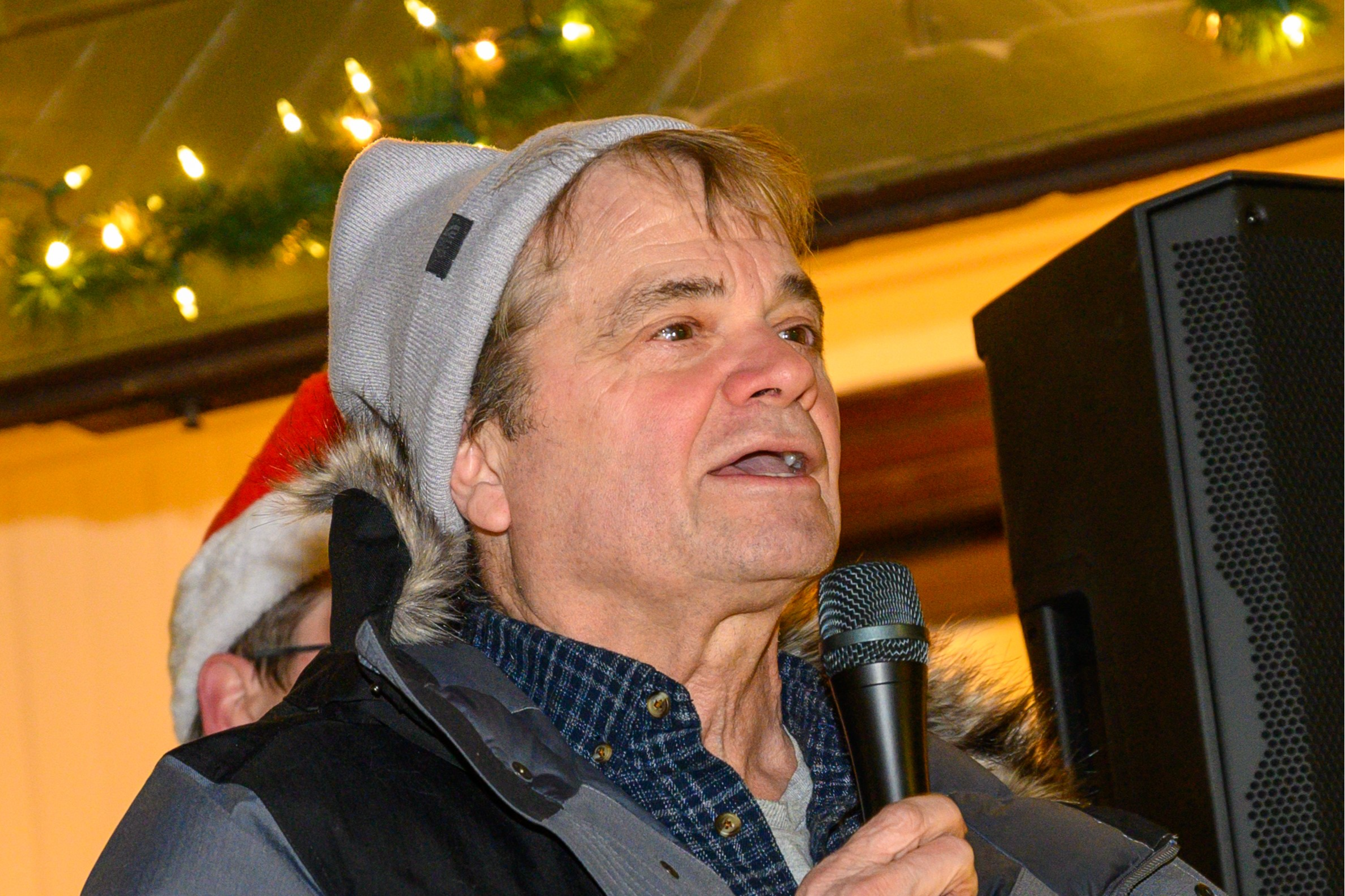 Rep Quigley speaks at a neighborhood Tree Lighting