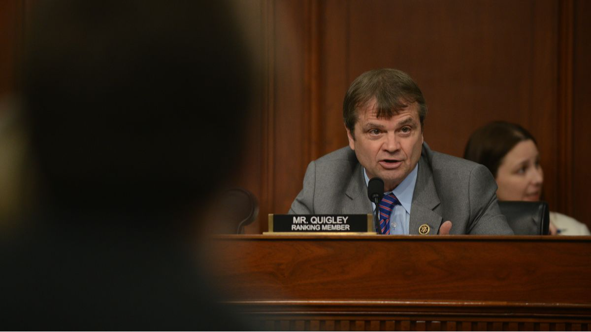 Mike Quigley speaks from a dias with a Ranking Member nameplate in front of him