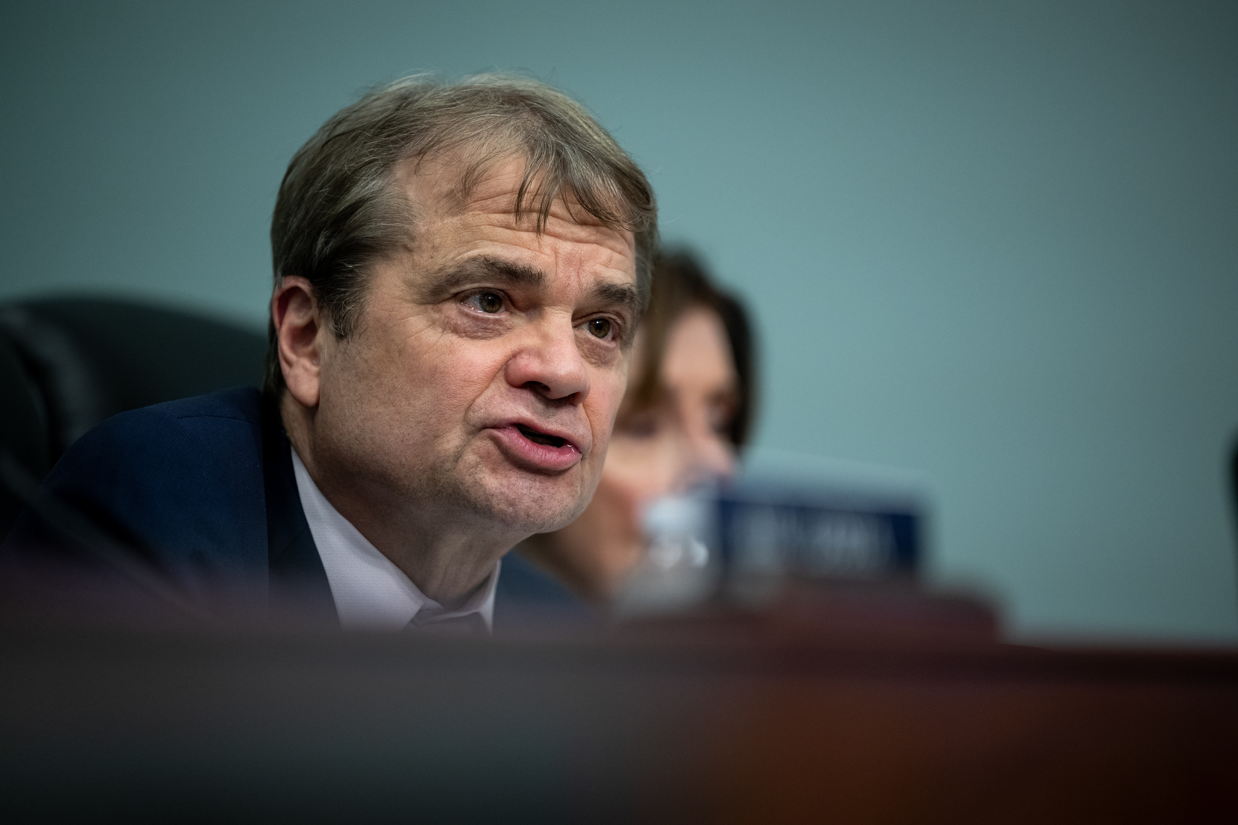 Rep Quigley speaks from a dais